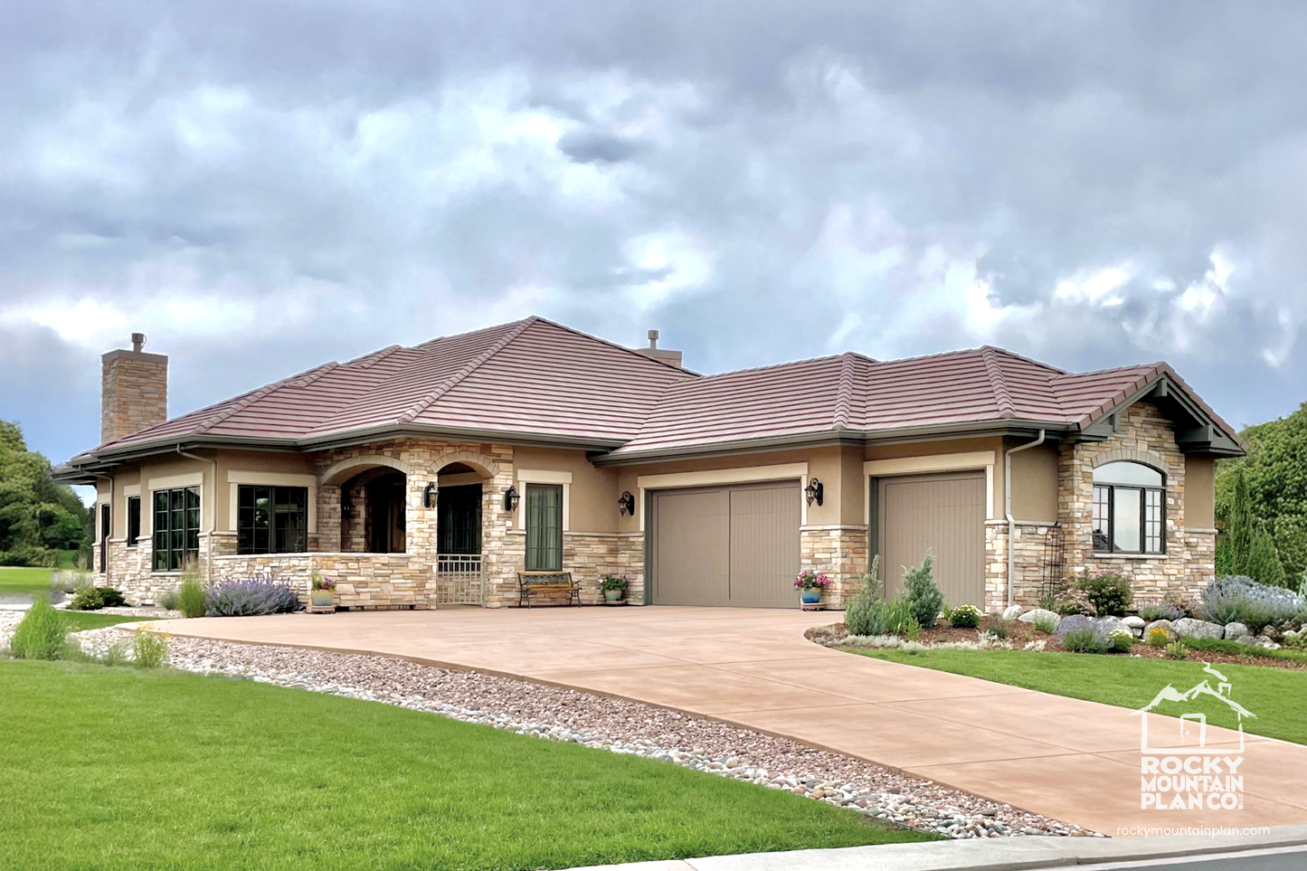 Upscale Tuscan-style home with a covered porch entry, arched openings, and a three-car garage with courtyard access.